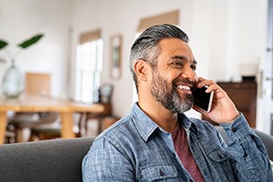 A middle-aged man talking on the phone
