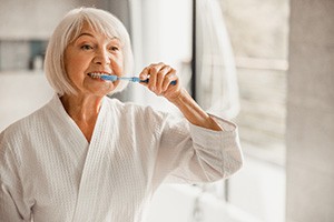 Older woman smiling in the mirror