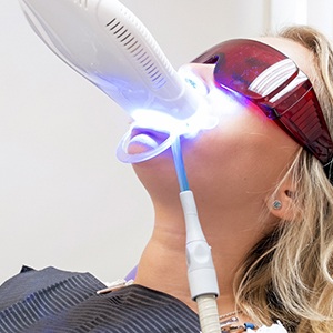 Patient undergoing in-office teeth whitening treatment